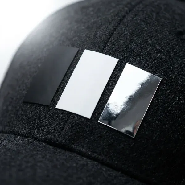 Matte black, matte white, and chrome flex patches shown side by side