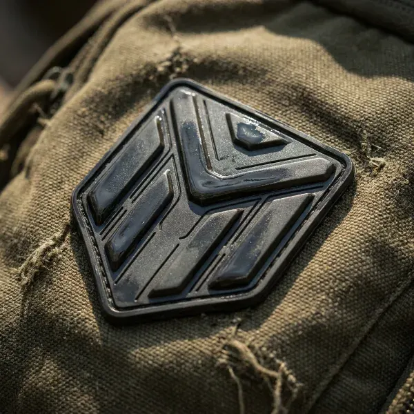 Close up of a raised PVC rubber patch with laser etched detail
