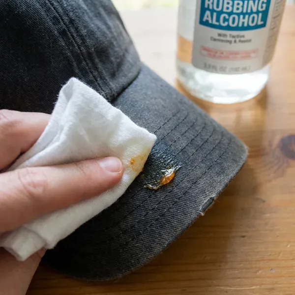 Cleaning adhesive residue off hat brim