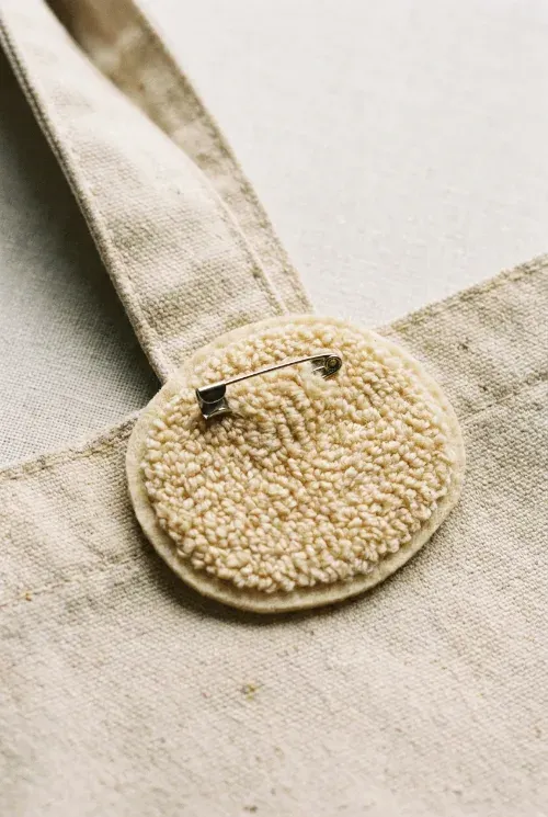 Chenille patch with safety pin backing