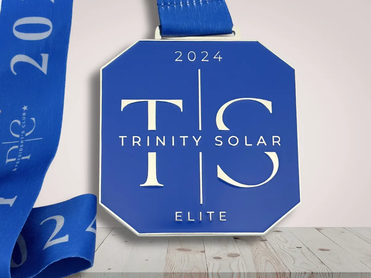 Custom employee service award medal with company branding on desk display