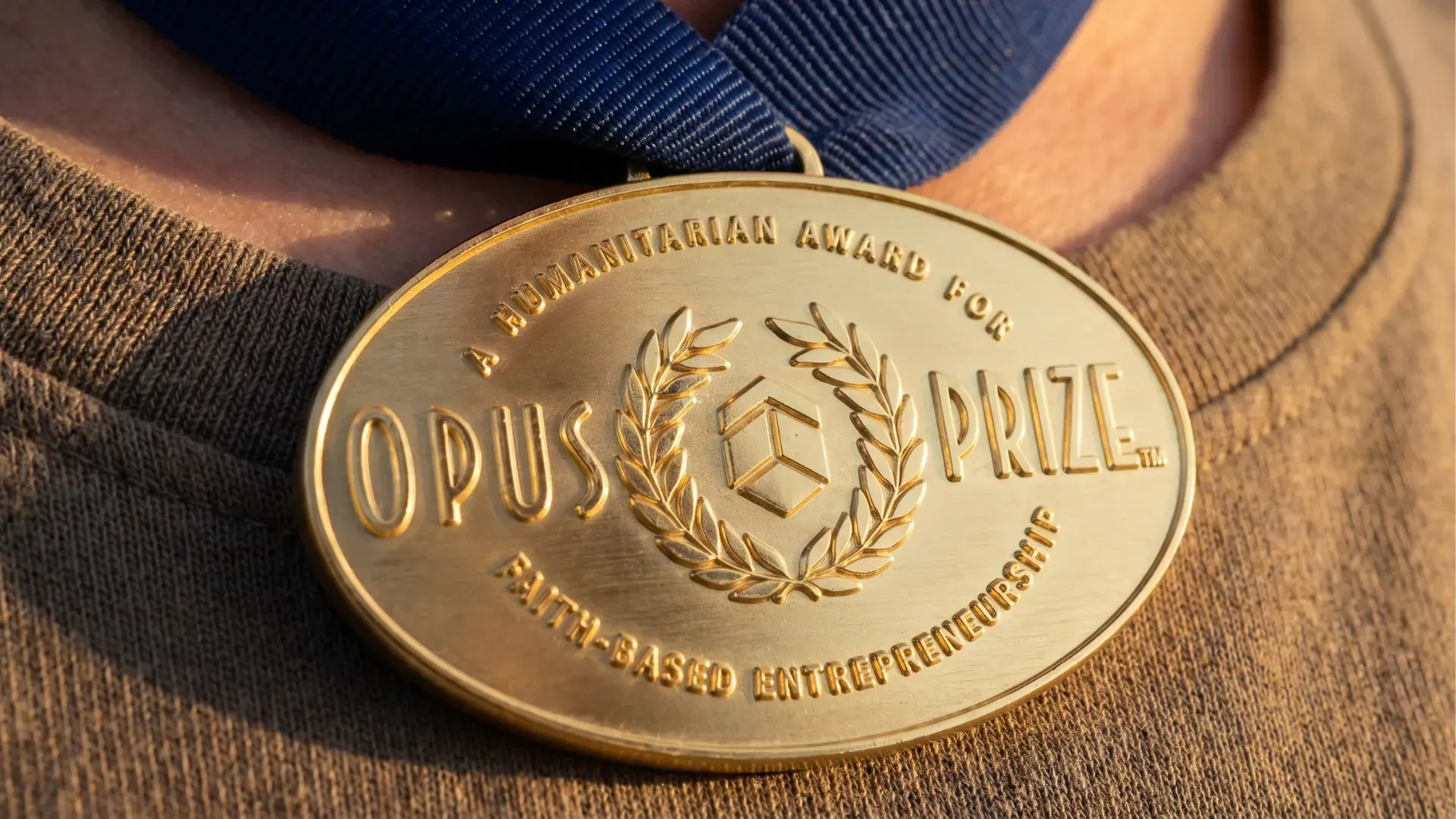 Close-up of custom gold and silver award medals with dramatic lighting