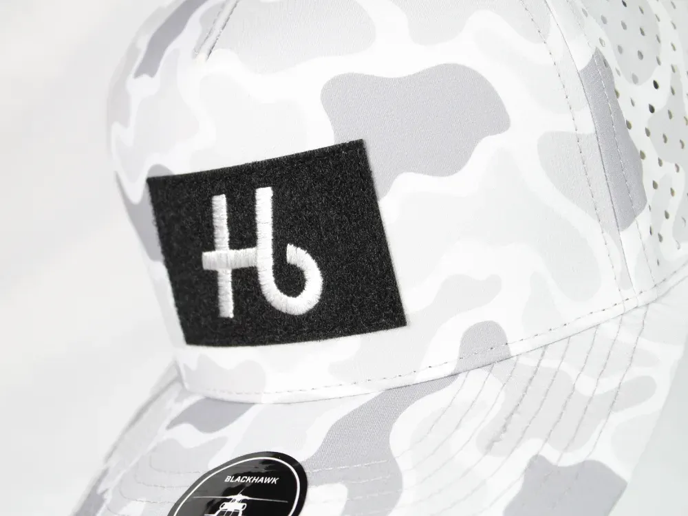 Custom snow camo trucker hat with embroidered logo patch