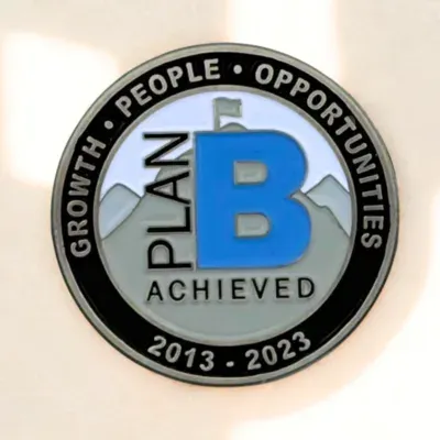 Custom 10-year service award lapel pin in antique silver finish with recognition values