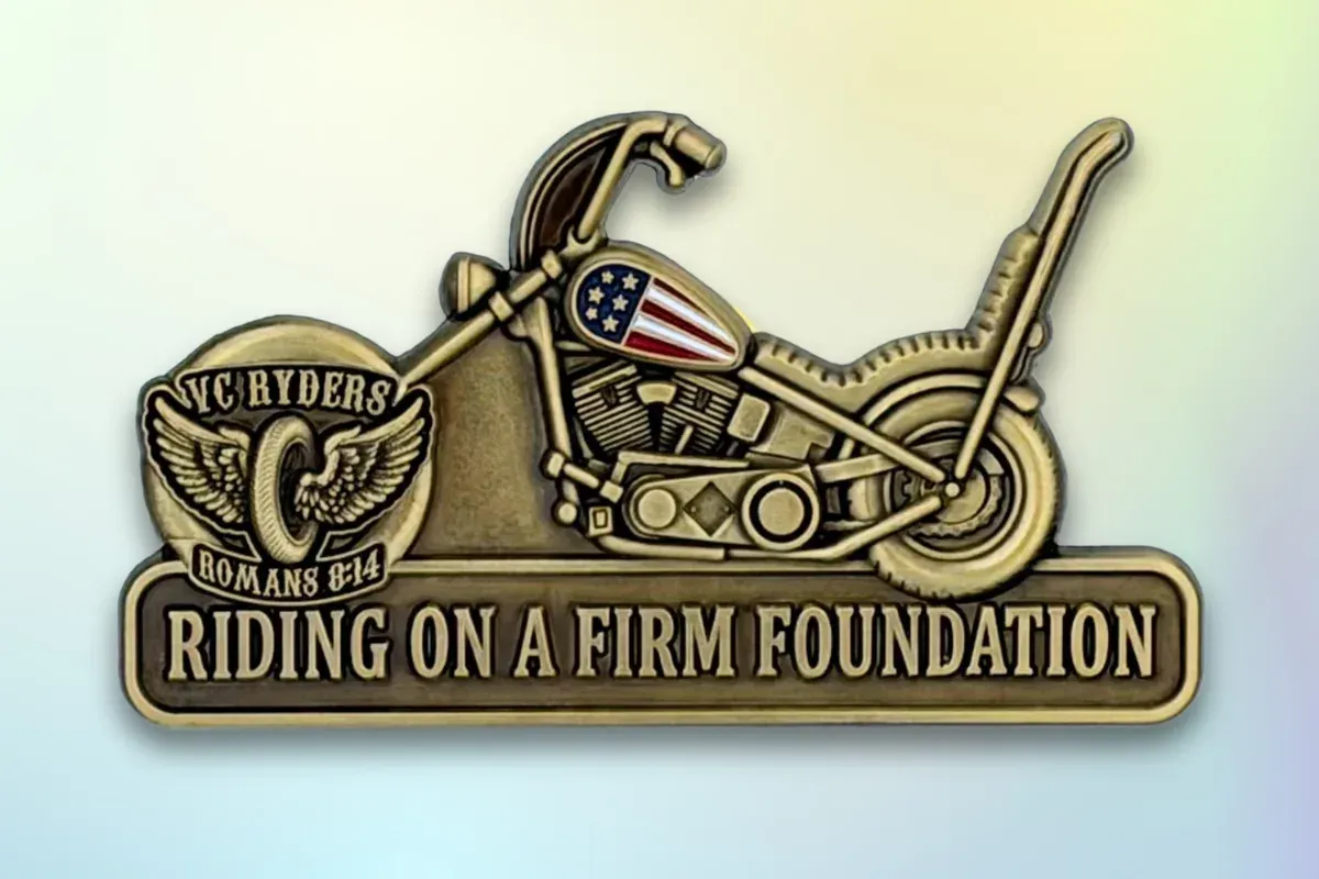 Custom die-struck biker lapel pin in antique bronze with motorcycle and club banner design