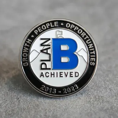 Custom soft enamel 10-year service award lapel pin in silver with company milestone branding