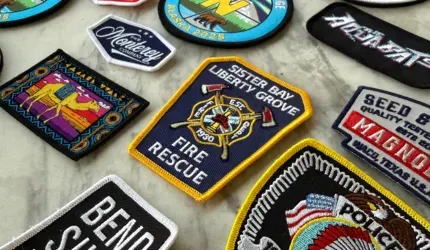 group of embroidered patches on table