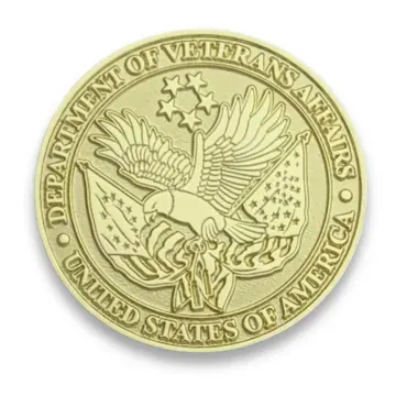 Custom gold Department of Veterans Affairs challenge coin with eagle emblem
