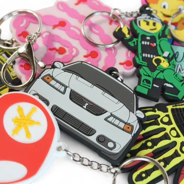 Group of custom PVC rubber keychains in various character and brand designs