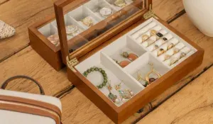 jewelry box with brass charms and earrings