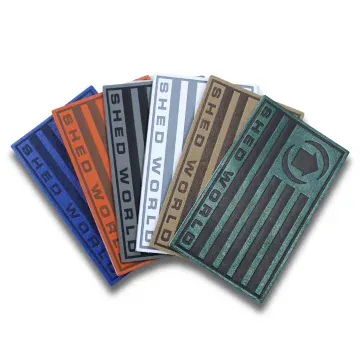 Custom leather patches displayed in various colors and finishes for hats and gear