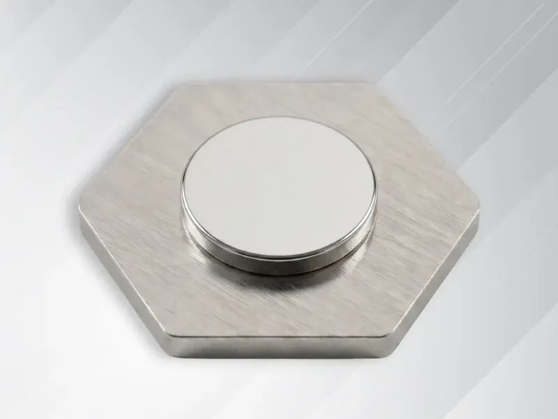 Reverse side of custom lapel pin showing round magnetic backing attachment
