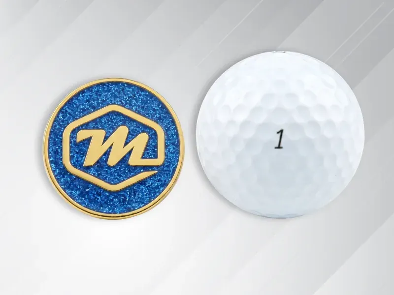 Award-sized 1.5 to 2 inch custom lapel pin shown next to a golf ball for size reference