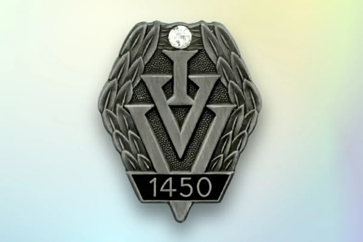 Custom die-struck pewter lapel pin with matte gray finish and a clear gemstone