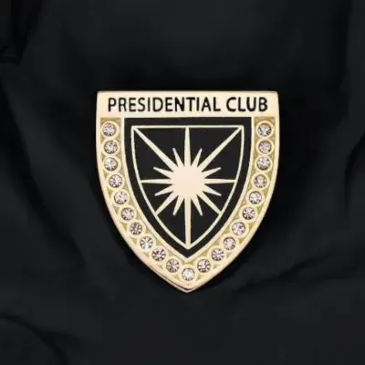 Custom executive recognition lapel pin shaped like a shield with star emblem