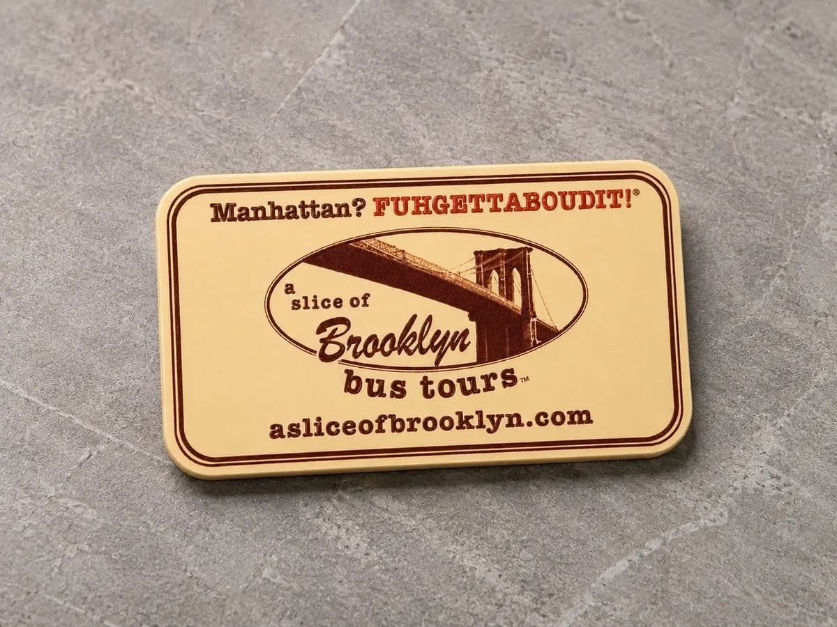 PVC business card magnet on concrete surface