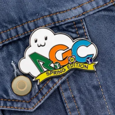 Custom soft enamel school spirit lapel pin with cartoon ghost mascot worn on a denim jacket