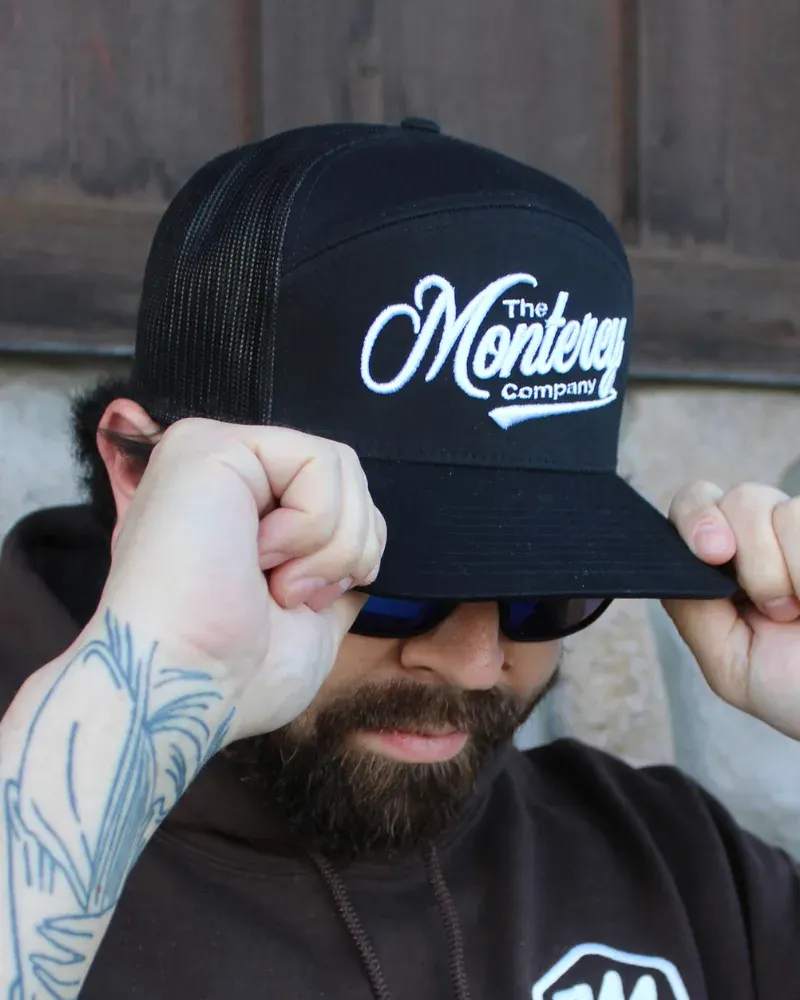 Black and white patch on black hat
