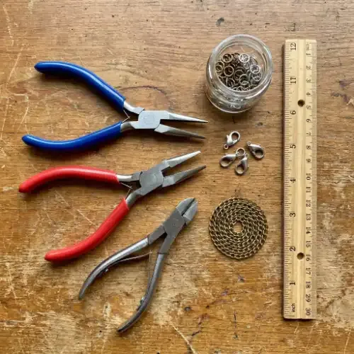 Flat lay of charm bracelet tools
