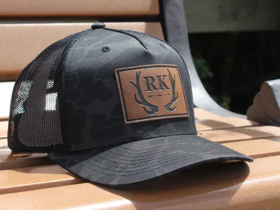 Hunter style camo hat with leather patch
