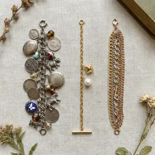 Three charm bracelet styles side by side: a packed vintage-style bracelet, a minimal modern build with two or three charms, and a mixed-metals stack