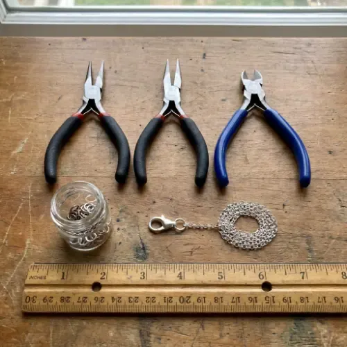 tools arranged neatly and a short length of cable chain