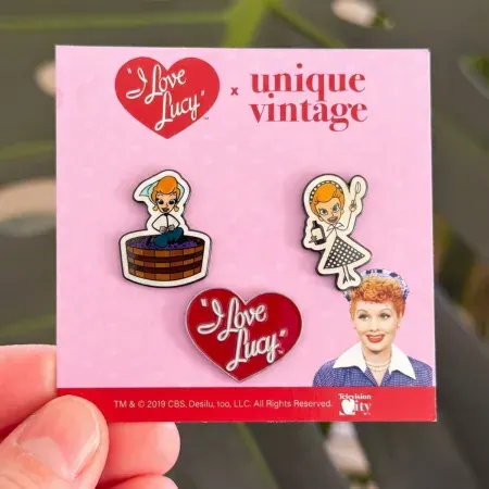 Custom enamel pin displayed on branded backer card artwork