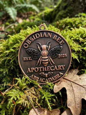 bee charm on green background