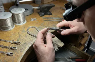 person creating a custom charm bracelet