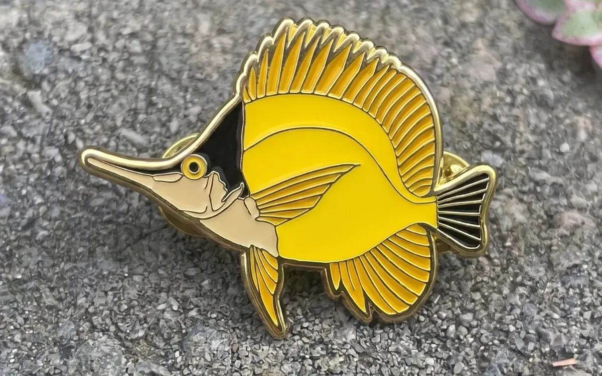 Custom soft enamel yellow fish pin with raised gold metal lines
