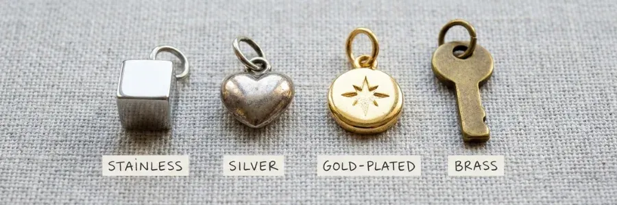 four small bracelet charms