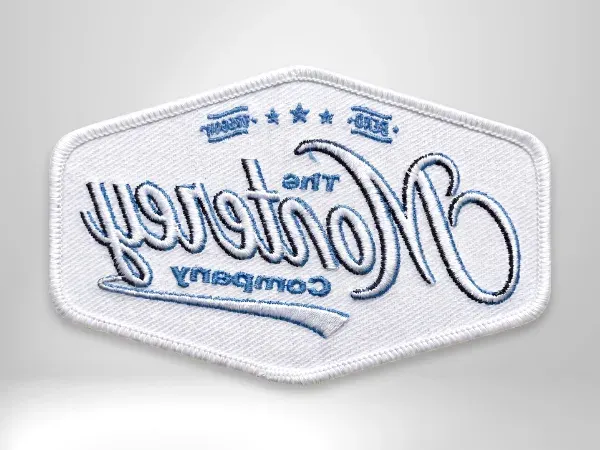 Custom embroidered Monterey Company patch with a sew-on stitched edge