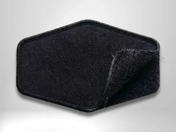 Black hat patch with hook-and-loop velcro backing