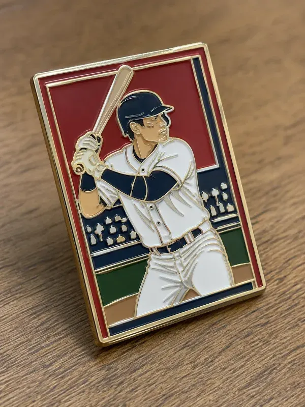 Close-up of colorful custom baseball trading pins spread out showing team mascot and star-shaped designs