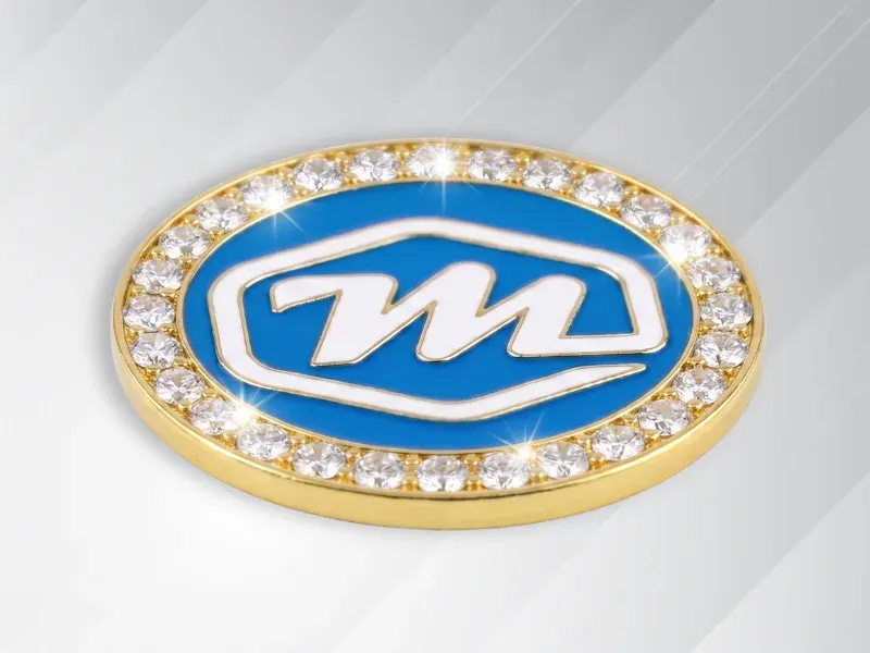 Monterey Logo as trading pin with row of gemstones on border