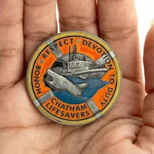 Antique brass challenge coin with sculpted missile design